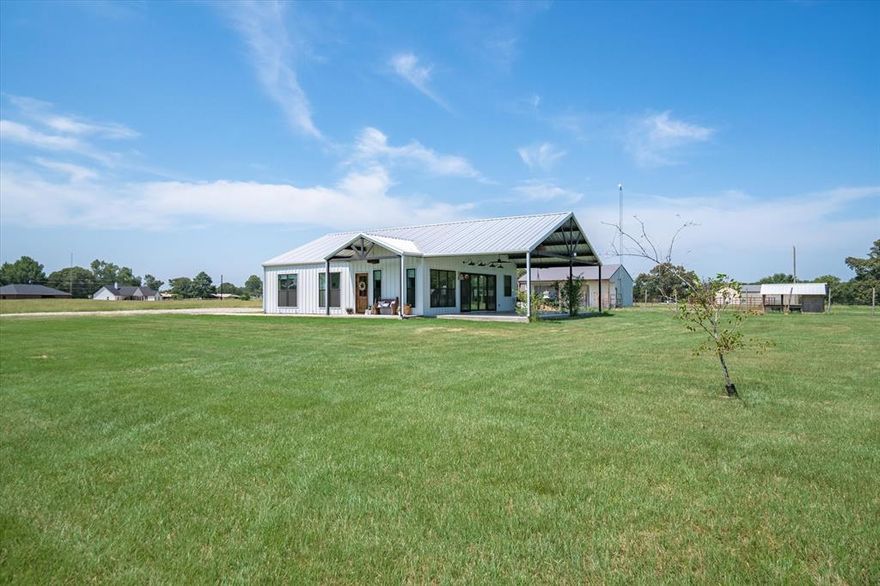 Owner agent. If you are looking for the country life only five miles from town don’t miss out on this beautiful home. This barndominium sits on 4 acres with fruit trees and a garden area. There is a 30x40 shop with concrete and goat stalls. The second electrical meter has an RV hook up. The house is full of details from the ceilings to the beautiful bathrooms. This is a split bedroom layout with three bedrooms and two bathrooms. Huge island for an eat in kitchen. Open floor plan is great for entertaining with the 16 foot sliding glass door that opens up  8 feet wide to the 20x40 side porch. Bring your animals and ideas to make your own little farmstead. Realtors and buyers to verify all information.