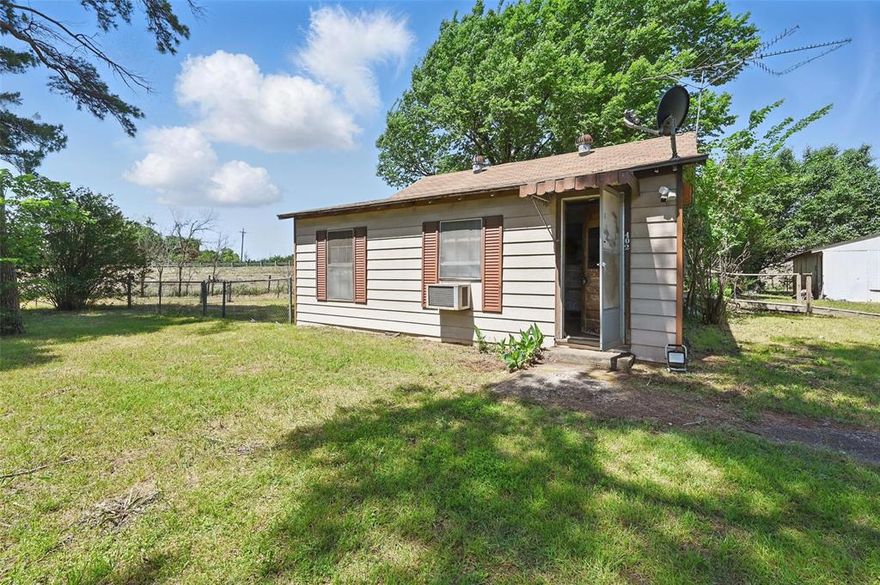 OWNER FINANCING AVAILABLE AT $1,200 A MONTH!  Nestled on a spacious 1.05-acre lot in the quiet Cotter Oaks subdivision, this 3-bedroom, 1.5-bath home offers a rare opportunity to bring your vision to life in a peaceful, country-style setting. With 1,085 square feet of living space, this single-story traditional home features an eat-in kitchen, a combination of carpet, linoleum, and wood flooring, and a versatile layout ideal for customization.

Enjoy the privacy of rural living with no HOA and a generous lot dotted with mature trees and large grassy areas—perfect for gardening, entertaining, or future expansion. The property includes a two-car covered carport, an open driveway, and both on-site and outdoor parking options. It’s fully fenced with chain link, and is equipped with electric utilities, septic, and a well.

Accessibility features include an approach ramp, making the home easier to navigate. The location is a commuter’s dream—just minutes from I-35W, offering quick access to Fort Worth and nearby amenities. Whether you're an investor, DIY enthusiast, or first-time buyer ready to renovate, this is your chance to own a slice of Texas countryside with big potential.

Seller Financing Requires 20% down on a 30 year note. Interest rate is negotiable with additional money down.