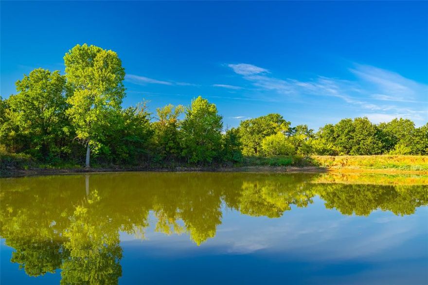 Located less than an hour from the DFW Metroplex, Hlavek Road Ranch offers the perfect blend of accessibility, recreation, and investment potential. This Wise County property is a true sportsman’s paradise, featuring thriving populations of whitetail deer, hogs, turkeys, ducks, and dove. Multiple ponds are spread across the ranch, with the largest just under an acre—ideal for fishing or wildlife enhancement.

Situated near the rapidly growing city of Decatur, this property is positioned in one of North Texas’s fastest-expanding areas. Whether you’re seeking a weekend hunting retreat, a private homestead, or a future development opportunity, Hlavek Road Ranch delivers unmatched versatility and long-term value.

LOCATION: Hlavek Road Ranch is perfectly located just 5 miles (about 10 minutes) from the growing town of Decatur, offering convenient access to local amenities while preserving the peace and privacy of a rural setting. The ranch is also ideally positioned for regional access—just 45 miles from Fort Worth, 40 miles from Weatherford, and 65 miles from downtown Dallas. Adding to its accessibility and long-term value, the property features over 1,000 feet of frontage on paved Hlavek Road, providing easy access and excellent potential for future development, subdivision, or a private entrance to your ideal homestead or hunting retreat.

TOPOGRAPHY, RANGELAND & HABITAT: Hlavek Road Ranch features a diverse and scenic landscape with a balanced mix of native pasture and wooded terrain—approximately 50% open rangeland and 50% mature hardwoods and brush cover. The native pastures provide ample grazing opportunities for livestock or wildlife forage, while the wooded areas, consisting of oaks, elms, and other native species, offer excellent cover and habitat for deer, turkey, and other game. Gently rolling topography creates multiple potential building sites with expansive views.