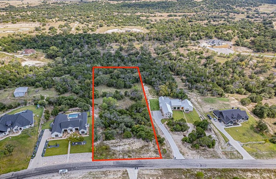 YOUR DREAM HOME AWAITS! Discover the perfect blend of country living and convenience with this 2.01-acre homesite in the prestigious Eagles Bluff community. Set within the highly sought-after Brock ISD School District, this property offers an incredible opportunity! With its high elevation and beautiful tree coverage, the lot provides both privacy and scenic views. The gated community of Eagles Bluff provides paved, private roads, spring-fed and stocked creeks and lake and is known for its peaceful atmosphere, giving you the tranquil country feel while still being just minutes from shopping, dining, and city amenities. Don’t miss your chance to own a piece of land in this desirable community—whether you’re planning your forever home or looking for a smart investment, Eagles Bluff offers the best of both worlds. YOU DO NOT WANT TO MISS THIS PROPERTY!