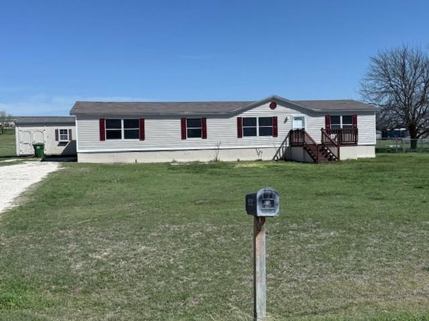 This beautiful home is ready for its next family — and their pets. Nestled on over an acre, the property includes a storage building and a dedicated dog run. Step inside to open, light-filled living spaces anchored by dramatic, deep-cherry stained pillars. The open living room, family room, dining area, and stately kitchen are designed to impress, with a stone-look accent in the kitchen. The oversized primary bedroom features an ensuite with double sinks and a separate shower. Move-in ready — schedule a showing and fall in love.