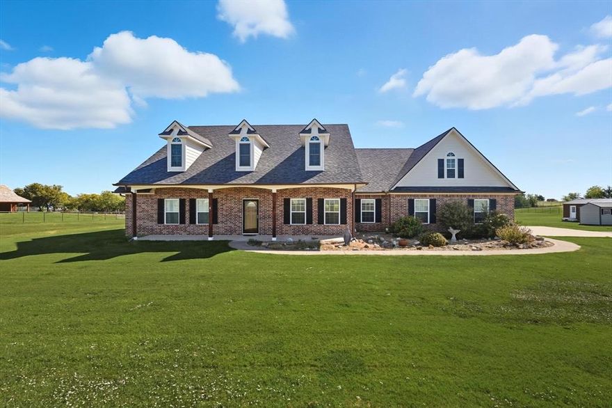 Come home to this wonderful, custom property of almost 2 and a half acres. You will have amazing views looking out to your private pond. Mornings on your back porch will be spent sipping your coffee while watching beautiful ducks and cranes land on the water. Evening you can look out to see your neighbor's cows grazing. The property in fenced and gated. Inside the home, you will find 4 bedrooms, 3 full baths, 2 dining areas, and a large living area with a fireplace and views to the back. The kitchen and breakfast room overlook the back as well giving you peaceful views while cooking and eating. The living area has a brick wood burning fireplace with a hearth. beams, and plantation shutters. The bedrooms are all spread out for privacy. The master is off by itself. There is a true mother-in-law suite with its own ensuite bath with walk in shower. The other two bedrooms are off to the back and share a bath. All the bathrooms have cabinets and a built-in hamper.  The back bedroom would make a perfect home office with views to the pond. Work from home with the total privacy and country feel. The home does have a true small office area near the master bedroom. There is a wet room area off the garage for when you come in with those dirty boots. Outside you will find a long covered front porch, and in the back you will find a nice covered back porch. There is also an extra concrete area that would be great for a firepit. There is a 16 x 32 stained cedar shop with electricity and AC. It has a reinforced floor for a small vehicle if needed. Don't forget the location. This amazing property is only 2.5 miles from Lake Ray Roberts Marina and close to shopping, restaurants, and I-35, but with a total country atmosphere. Sanger is growing, and the new Tom Thumb opens soon. It's a must see today.