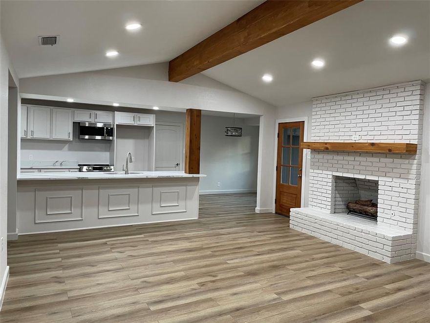 This ONE-STORY home was taken down to the studs & rebuilt with an open floor plan, ensuite master bathroom, large closets & expanded kitchen. New water & sewer lines installed, completely remodeled Kitchen & Bathrooms, new flooring, new lighting fixtures, new doors, new drywall, new paint.  NEW NEW NEW! The expanded Kitchen features new custom cabinets, pantry, new quartz counter tops with ample workspace, new appliances & adjacent eating area. The roomy Family room features a wood burning fireplace with gas starter & low maintenance Luxury Vinyl Plank flooring. The large Master Bedroom with ensuite bathroom features dual vanities & spacious shower, and large walk-in closet.  Extra living spaces include an office with a bay window, and a 'craft room' off of the laundry room with built in cabinets and work area.  Don't miss the large backyard & storage shed. This quiet neighborhood is located minutes from Grapevine Lake, Dove Park, Dove Water Park, bikes trails, & sports fields!