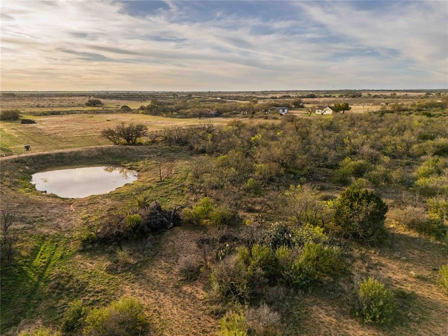 Hurtado Ranch is a 196-acre property located approximately 5.5 miles northwest of Brady in McCulloch County. The ranch features approximately 1.4 miles of frontage along US Highway 87, with a main gated entrance and three additional access points.

Improvements include a recently remodeled 1,500 square foot ranch house and a 2,500 square foot shop building. The property also includes three full RV hookup sites. New perimeter fencing surrounds the ranch.

The land includes a mix of native vegetation and open areas suitable for multiple uses. A wet weather creek runs through the property, and there are four earthen tanks providing water for livestock and wildlife. Two ponds contain bass and panfish.

Wildlife species observed on the ranch include white-tailed deer, axis deer, turkey, quail, dove, and ducks. Multiple blinds and feeder setups are in place.

The property is suited for hunting, recreational use, livestock grazing, or agricultural activities. Its location provides convenient access to Brady for supplies and services while maintaining a rural setting.