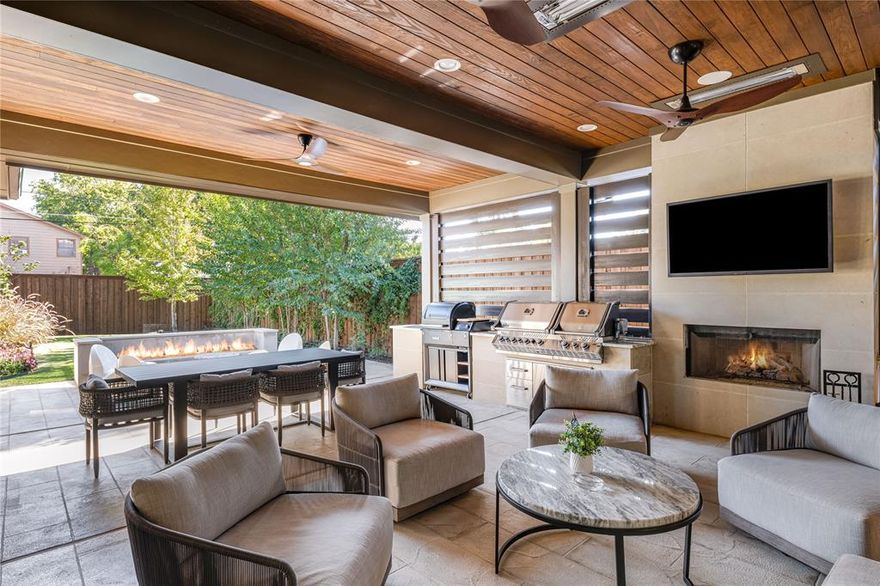 This exceptional custom residence is thoughtfully upgraded well beyond typical new construction. It delivers elevated everyday living with rich, warm finishes that define today’s most sought-after design trends. Completed in 2023, this home has a rare a 3 car garage, on an oversized 163’ deep lot, which allows for expansive backyard space with ample room for a future pool. The first floor flows effortlessly, through two sets of black iron double doors to an extended covered patio that is fully equipped with a built-in grilling station, ceiling heaters, fireplace, privacy wall, and a striking modern fire feature, delivering an experience that feels intimate yet welcoming. White oak wood floors, Hubbardton Forge and Restoration Hardware lighting, Fisher & Paykel appliances, and a Napoleon grill reflect the elevated level of craftsmanship and finish carried throughout the home. Additional enhancements include a fully climate-controlled wine room designed for approximately 300 bottles, thoughtfully integrated quartzite and custom stone detailing throughout key spaces of the home, and upgraded, high-performance HVAC systems offering a level of comfort and efficiency that surpasses standard new-build specifications. Over $30,000 in professionally added trees over the past two years create a setting that already feels established and mature. The downstairs primary suite serves as a true retreat, featuring exquisite stone detailing, designer lighting, motorized blinds, and dual closets. Upstairs, the expansive game room—currently designed as a golf simulator lounge—includes a bar with beverage fridge and access to a front balcony. An adjacent bonus room (not counted as a bedroom) offers flexible space ideal for a fitness studio, second study, or private mahjong room.
Ideally located in one of Dallas’ fastest-growing neighborhoods, this remarkable home offers a true in-town lifestyle — walkable to Inwood Village and just minutes from Love Field Airport.