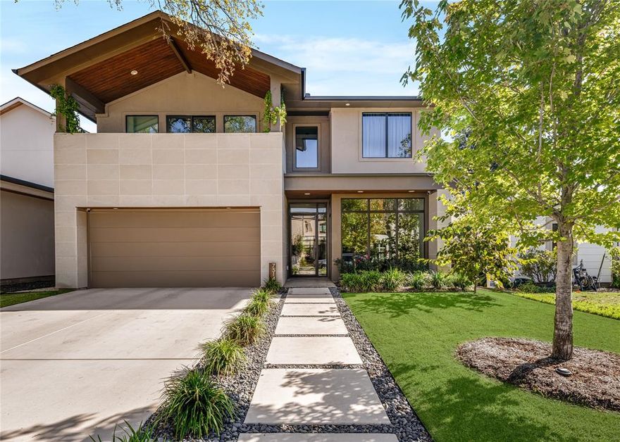 Situated on one of the most desirable blocks in the Bird Streets, this tree-lined street is surrounded primarily by newer homes and offers minimal through traffic thanks to its cul-de-sac–like setting. This exceptional custom residence is thoughtfully upgraded well beyond typical new construction. It delivers elevated everyday living with rich, warm finishes that define today’s most sought-after design trends. Completed in 2023, this home has a rare a 3 car garage, on an oversized 163’ deep lot, which allows for expansive backyard space with ample room for a future pool. The first floor flows effortlessly, through two sets of black iron double doors to an extended covered patio that is fully equipped with a built-in grilling station, ceiling heaters, fireplace, privacy wall, and a striking modern fire feature, delivering an experience that feels intimate yet welcoming. White oak wood floors, Hubbardton Forge and Restoration Hardware lighting, Fisher & Paykel appliances, and a Napoleon grill reflect the elevated level of craftsmanship and finish carried throughout the home. Additional enhancements include a fully climate-controlled wine room designed for approximately 300 bottles, thoughtfully integrated quartzite and custom stone detailing throughout key spaces of the home, and upgraded, high-performance HVAC systems offering a level of comfort and efficiency that surpasses standard new-build specifications. Over $30,000 in professionally added trees over the past two years create a setting that already feels established and mature. Upstairs, the expansive game room—currently designed as a golf simulator lounge—includes a bar with beverage fridge and access to a front balcony. An adjacent bonus room (not counted as a bedroom) offers flexible space ideal for a fitness studio, second study, or private mahjong room. Ideally located in one of Dallas’ fastest-growing neighborhoods, walkable to Inwood Village and just minutes from Love Field Airport.