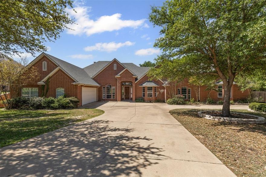 Spacious Single-Story Brick Home in Laguna Vista – Perfect for Multi-Generational Living or Entertaining! Welcome to this beautifully designed 5-bedroom, 3.5-bathroom home nestled on a large, fenced lot filled with mature trees and peaceful backyard views. This thoughtfully laid-out, single-story home offers space, comfort, and versatility. Step inside to an open-concept living, kitchen, and dining area that’s flooded with natural light. The kitchen is a dream for any home chef, featuring granite countertops, a large island, walk-in pantry, double ovens, built-in fridge and cooler, an electric cooktop, a coffee bar, and a breakfast bar — all designed to bring people together. The cozy living room boasts a stone, corner fireplace with a mantle and ample space for your favorite furniture. A designated office provides a quiet space to work or study. The laundry room offers additional cabinetry, a sink, and room for an extra fridge. The spacious primary suite includes dual sinks, a jetted tub, separate shower, and a large custom walk-in closet with built-in shelving. On the opposite end of the home, you’ll find a private in-law suite complete with its own kitchenette, built-in storage, half bath and access to a private patio. This flexible space could also serve as a second living room or a game room. Additional highlights include generous closets and storage space throughout, a two-car garage, large circular driveway, and gated boat parking behind the fence. Located just over 2 miles from Hunters Park where you can access the public boat ramp! This home combines peaceful surroundings, smart layout, and convenience — no city taxes or hoa! Schedule your showing today!