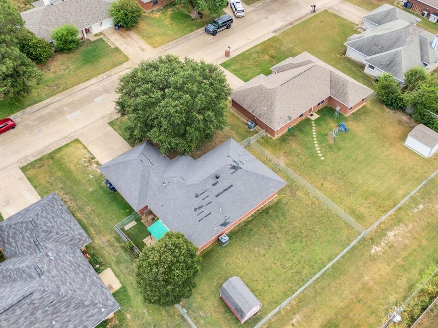 Welcome to a place where comfort, charm, and opportunity come together in one of Red Oak’s most inviting, well-established neighborhoods. This beautifully maintained 3-bedroom, 2-bath home with a 2-car garage sits on a generously sized lot, offering the kind of space and flexibility that truly elevates everyday living.  Step outside and imagine your future backyard oasis—whether it’s a sparkling pool, vibrant garden, play space for the kids, or the ultimate entertaining retreat. The covered back porch is perfect for morning coffee or evening gatherings, while the added storage building brings convenience and versatility to your outdoor lifestyle.  Inside, you’ll find a thoughtfully designed floor plan that blends functionality with warmth. Natural light fills the living spaces, creating an inviting atmosphere that instantly feels like home. Whether you’re a first-time buyer, looking to downsize, or simply ready for a fresh space to make your own, this home offers the perfect canvas.  Nestled in the heart of Red Oak, you’ll enjoy small-town charm with big-time growth. The area continues to thrive with expanding opportunities, including the highly anticipated Google data center nearby—bringing energy, development, and long-term value to the community. With quick access to Highway 67 and Highway 287, you’re just a short drive from the dining, shopping, and entertainment of the greater DFW Metroplex.  Cozy, connected, and full of potential—this is more than just a house, it’s a place to truly call home.
