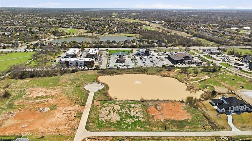 Build your dream estate on this exceptional 2-acre homesite at 2701 Romero Way in the desirable Hudson Hills community of Bartonville. This beautiful property features a private pond on the lot, creating a peaceful and scenic backdrop for a truly one-of-a-kind custom home. With generous space and natural beauty, the homesite offers endless possibilities for designing a luxury residence that blends indoor comfort with outdoor living.

Situated on a quiet interior lot, the property provides both privacy and picturesque water views—an increasingly rare feature in today’s market. Bring your own builder and take advantage of the flexibility to create a home tailored to your vision, whether that includes expansive outdoor entertaining spaces, a resort-style pool, or thoughtfully designed landscaping that enhances the pond setting.

Hudson Hills is an emerging luxury community in Bartonville featuring custom homes by some of North DFW’s premier luxury home builders. The neighborhood is quickly gaining attention for its spacious estate lots, beautiful architecture, and ideal location within one of the fastest-growing luxury real estate markets in the Dallas–Fort Worth Metroplex.

Enjoy the space and tranquility that comes with country-style living while remaining just minutes from everyday conveniences. The property is located near the vibrant Marty B’s entertainment district, offering dining, live music, and social gathering spaces just a short drive away. Nearby shopping, dining, and major commuting routes provide easy access to surrounding areas while preserving the peaceful atmosphere Bartonville is known for.

With its private pond, generous acreage, and prime location, this homesite presents a rare opportunity to build a custom luxury estate in one of North Texas’ most desirable communities.