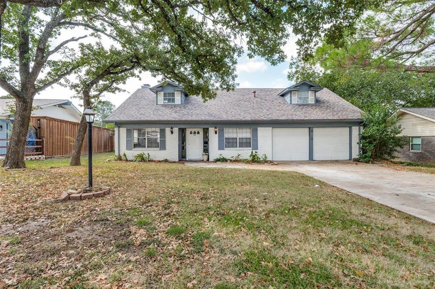 This remodeled 4 bedroom home is conveniently close to I-30 and the Arlington Entertainment District, yet nicely tucked away in a friendly neighborhood. It offers low maintenance, modern flooring throughout, with a remodeled kitchen featuring quartz counters, tile backsplash, stainless steel appliances and sink, and ample cabinetry. The family room with fireplace is adjacent to another living area, which could be used as an office. There is a full-size dining room plus a breakfast nook for extra seating. The primary bedroom is downstairs and has access to a remodeled bathroom. Upstairs you will find three good-sized secondary bedrooms and a full bathroom with tile shower surround and modern vanity. This property is on a little more than a third of an acre, so get ready for family gatherings in the impressive backyard. This home is great for an owner occupant, but also has been a successful rental for the last few years.