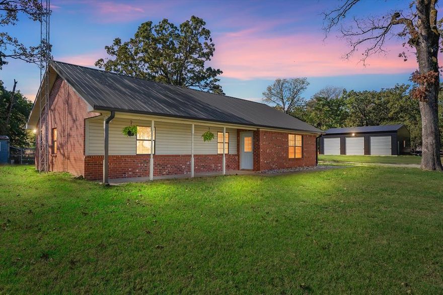 From the moment you turn onto the long gravel drive, this place already feels like home. The open pasture on both sides, the tall trees, the quiet, it all pulls you in before you even reach the front porch. The house itself is simple in the best way. A sweet 2 bedroom, 2 bath home that has been lovingly freshened up with new paint, new flooring, and a bright vaulted living room where sunlight pours in. It feels calm the minute you step inside. The kitchen has plenty of space to cook while looking out over the trees, and the remodeled primary bathroom gives the home a clean, updated touch that makes everyday living feel nicer. But the real magic is outside. All 9 acres are open and usable, with hay in the field and room for animals, gardens, or just mornings spent walking the land with a cup of coffee. There are two great shops, one insulated with a large overhead door, and a newer three bay shop that is perfect for storing equipment, working on projects, or building out the hobby you have always talked about starting. And the cutest little chicken coop sits nearby, ready for fresh eggs and slow country mornings. It is quiet here. Peaceful. The kind of place where you notice the sky more, where evenings feel longer, and where life naturally slows down in the best way. If you have been looking for a home that gives you space, simplicity, and a little bit of joy every time you pull in the driveway, this is it.