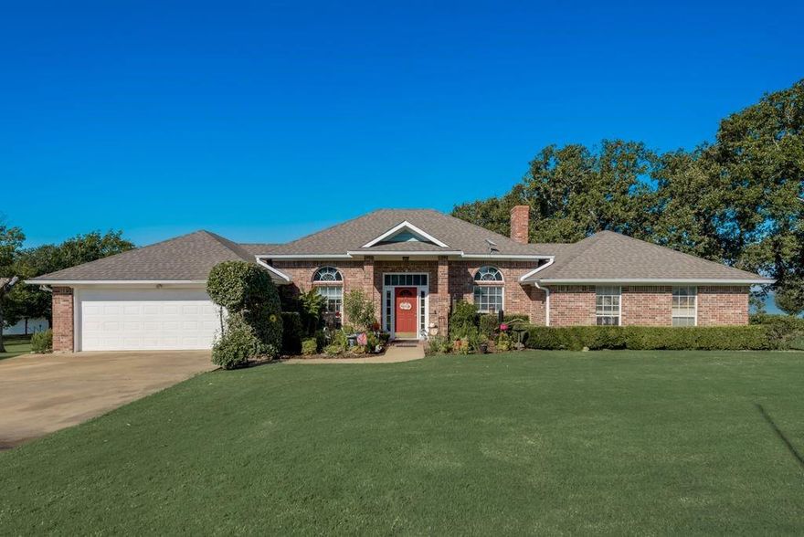 Looking for a piece of paradise? Look no further! This home is located on Richland Chambers Lake, one of the best kept secrets in Texas. The open water view & massive deck are perfect for enjoying the incredible sunsets over the lake. Enjoy the convenience of a boathouse & take your boat out anytime you want! The Lakeside Luxury starts at the front door where you're greeted by a wall of windows facing the lakeside, but if you're looking for something a little more special this home has it - an expansive enclosed porch overlooks the impressive back deck and open water views!  The home is a spacious 3 bedroom, 2 bathroom featuring a split floor plan, roomy kitchen with tons of counter space, and a gas log fireplace to cozy up to on cool evenings. The primary bedroom has private porch access, a jetted, walk-in tub & water views of RCL! Located in the Rustling Oaks Subdivision, you'll have access to the private boat ramp for property owners. Come see what all this home & view has to offer!