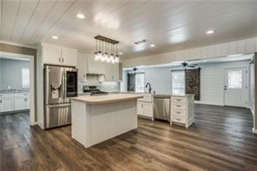 Set on nearly an acre beneath wide Texas skies, this Tioga home offers the kind of space and simplicity that’s getting harder to find. Inside, warm  luxury plank floors and finishes that create a welcoming atmosphere from the moment you step through the door. The kitchen is the heart of the home, with granite counters, inland kitchen, and a farmhouse sink that makes everyday tasks feel a little more special.

Just off the main living area, an oversized pantry and laundry room keep life organized, while a hidden safe room adds a unique touch you won’t find anywhere else. The bedrooms are comfortable and bright, and both bathrooms are great a family.

Outdoors, the covered porch invites morning coffee or evening unwinding. The oversized detached garage—complete with a huge walk-up attic that has complete floored and offers room for hobbies, storage, or weekend projects. Workshop in back that's insulated and has an ac unit.

This is a place where you can slow down, spread out, and enjoy the best of small-town living while staying close to everything you need. Over-sized 26x30 garage, big enough for large vehicles or your boats AND the attic is completely floored for extra storage space! Sits on .83 acres in town on a corner lot.

TV and mounts in bedroom and living room stays. Fridge stays with accepted offer.