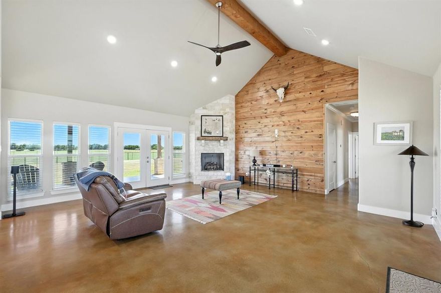 Preferred lender offering up to 1% of loan value in credits to buyer. 

Beautiful ranch-style home on 10 ag-exempt acres with no restrictions and no HOA! This well-maintained property is fenced and ready for livestock, offering the perfect blend of peaceful country living with city conveniences just minutes away. The spacious open floor plan is filled with natural light and features stunning wood beam accents in the living area. The kitchen includes custom cabinetry, granite countertops, and a large island—ideal for both everyday living and entertaining. The primary bedroom offers views of the property and a beautiful en-suite bath with rock-style finishes in the shower and ample storage. Outside, enjoy quiet mornings or Texas sunsets on the oversized covered porches. The 30x40 workshop is wired for welding, includes two RV hookups, has it's own electricity, and provides plenty of space for storage. Whether you’re looking for a place to spread out, raise animals, or simply enjoy the outdoors - this property has it all!