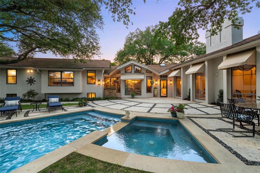 Elegant Estate in Prestigious Wood Lake – A Resort-Style Entertainer’s Dream. Located in the heart of the sought-after Wood Lake neighborhood, this 6,600+ sq ft estate redefines luxury living with timeless elegance, resort-style amenities, and expansive entertaining spaces. A covered drive and grand formal entry set the tone for this remarkable home. The 700+ sq ft formal living room features soaring ceilings, Brazilian cherry hardwoods, a quartz crystal chandelier, and an antique marble fireplace framed by floor-to-ceiling windows. Designed for entertaining, this space has hosted dinner parties of 50+ and gatherings of hundreds with ease. A sunlit gallery with views of the backyard and terrace provides a tranquil space to display art or unwind. The formal dining room comfortably seats 12 for elegant dinners and holidays. The chef’s kitchen is equipped with a new Thermador induction range, Sub-Zero fridge, double ovens, warming drawer, island, and ample cabinetry. It opens to a cozy den with exposed beams, a brick fireplace, and custom built-ins. Outdoors, a private oasis designed by Dallas landscape architect Kelly James includes a dramatic waterfall pool, spa, fire pit, and a full Viking outdoor kitchen—ideal for al fresco dining and entertaining. A large garden area offers space for farm-to-table evenings. The primary suite is a true retreat with a sitting area, double-sided fireplace, private office, and spa-inspired bath featuring a jetted tub, dual-entry shower, and custom walk-in closet with dressing zones. Each guest suite includes an en-suite bath; one opens to a private balcony. A downstairs media room with a full bath and separate entrance offers flexible use as a fourth bedroom, guest suite, or teen retreat. This exceptional estate offers refined living in one of Waco’s most exclusive communities.