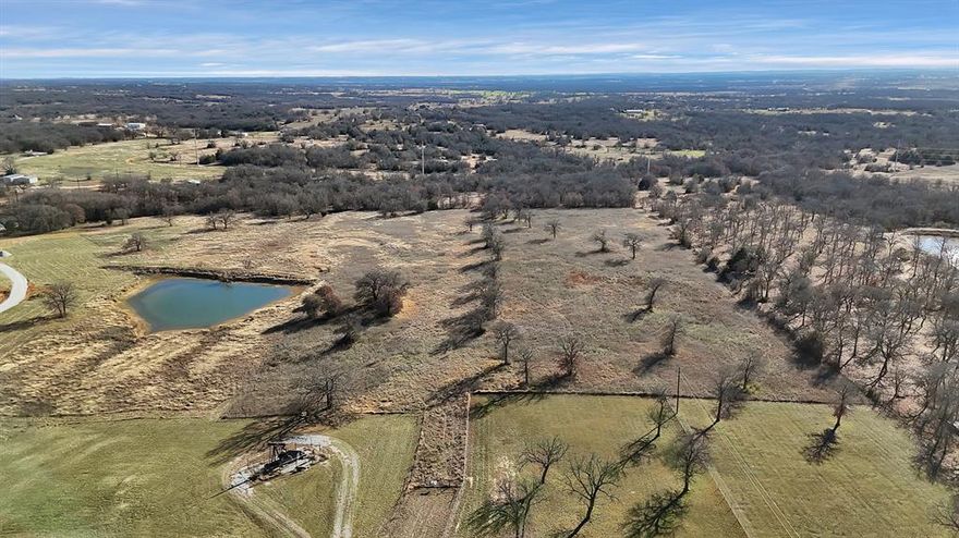 **Your Canvas Awaits in Crooked Oak Estates** Picture yourself standing beneath the canopy of mature trees, the gentle Texas breeze rustling through the branches, while ten sprawling acres of possibility stretch out before you. This is Lot 3 of Crooked Oak Estates, and it might just be the beginning of your next great adventure. This exceptional parcel of unimproved land represents a rare opportunity to craft your dream from the ground up. With over ten acres at your disposal, you will have the space to breathe, to create, and to truly make something extraordinary. Whether you envision a sprawling ranch-style homestead, a modern farmhouse retreat, or simply a peaceful escape from the hustle of urban life, this property provides the perfect foundation for your imagination to run wild. The natural landscape here is enchanting. Mature trees dot the property. The land comes fully fenced, delivering both privacy and security right from the start. Location strikes an ideal balance between seclusion and accessibility. Just ten minutes will take you into Decatur, where you will find shopping, dining, and essential services. The community boasts excellent amenities, including Decatur High School and Kenny Renshaw Park, making this location particularly appealing for families who value both quality education and outdoor recreation. For those who need to venture into the Dallas-Fort Worth metroplex, the commute clocks in at under an hour, meaning career opportunities and big-city attractions remain within comfortable reach without sacrificing your countryside sanctuary. This is Texas living at its finest: wide-open space, starlit nights, and the freedom to build exactly what your heart desires. Your piece of paradise is waiting!