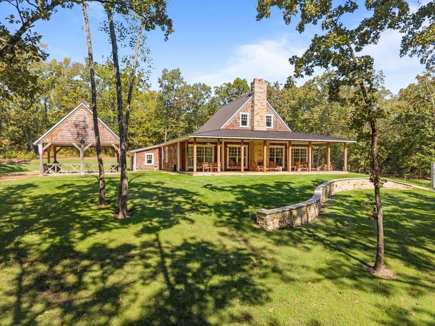 Set on a private 5-acre homesite in the exclusive Cross Pines Ranch, this 4BR, 3BA home blends timeless ranch character with thoughtful, high-end craftsmanship. Every detail was intentionally chosen—from the cedar shingle siding and handmade solid-core doors to the Trinity oak floors, brass library lights, and sound-insulated interior walls. A standing-seam metal roof and full spray-foam insulation keep the home efficient and comfortable year-round.

 

The kitchen is a true highlight, featuring Crema Marfil marble counters, glass-inset cabinetry, specialty storage drawers, butcher-block island, custom vent hood with brass arm lights, a 6-burner KitchenAid range with griddle and double ovens, and a large cast-iron sink. The custom bunk room offers two twins over two queens with built-in brass lights and charging shelves, while the bathrooms feature Carrera Blanco marble throughout.

 

Outdoor living shines with a screened-in porch, double-sided stone fireplace, a beautifully designed firepit area with lighting, custom swings, zoysia yard with full sprinklers, hogwire fencing, and a 2-car carport finished with fans, speakers, and lighting. A whole-house Generac generator, two tankless water heaters, Starlink internet, Sonos sound system, and a 1,000-gallon buried propane tank add convenience and peace of mind.

 

Cross Pines Ranch offers an unmatched lifestyle with stocked fishing lakes, a full-service equestrian center, private gun club, clubhouse with pool, miles of trails, and dedicated full-time ranch staff—an ideal retreat just 90 minutes from Dallas.
