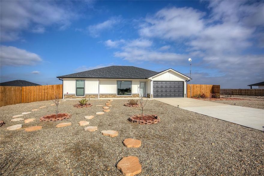 Discover this beautifully maintained, nearly new home featuring 3-bedrooms, 2-baths, situated on just under 1 acre.  Located  in a quiet country development West of Paris, TX, offering the perfect balance of peaceful living with convenient access to shopping, schools, and medical care.  Only 1 year old and truly immaculate, this home features a desirable open floor plan with durable laminate flooring throughout. The spacious eat-in kitchen boasts granite countertops, a large center island, and stainless steel appliances, making it ideal for both everyday living and entertaining.
Additional highlights include a 1-car garage, concrete driveway, and privacy fencing for added comfort. The rock landscaping in both the front and backyard provides attractive, low-maintenance curb appeal.  A move-in-ready gem with modern finishes in a serene setting—this home is a must-see!