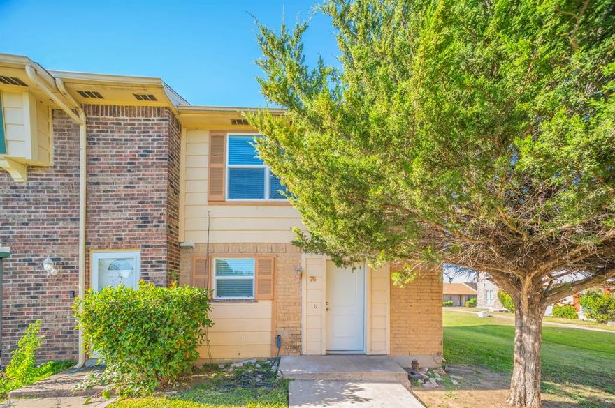 Desirable end unit with a full two car garage! Updated, vacant and move in ready! Greenbelt area right out the front door with a covered sitting area. Downstairs you will find the living, dining, kitchen and half bath areas. Totally updated kitchen with stainless steel appliances including a refrigerator! Stone countertops and all new cabinets and doors. Fresh paint, nice wood flooring, updated windows and new blinds thru out. Downstairs you will also find a large bonus room with HVAC. Large laundry room downstairs too. Upstairs are two large bedrooms each with a full bath. Nice size closets. The attic is finished out and makes for excellent storage or use your imagination. Full two car rear entry garage with opener and guest parking is just steps away. No city water bill! Water, sewer and trash pick up are covered by the HOA. HOA also takes care of the common areas, even the front yard and landscaping. The HOA also takes care of some of the exterior maintenance such wood rot, painting and some fence work. Super location just minutes to shopping, schools and much more. I-20 is just minutes away. President George Bush Turnpike is also just minutes away with an assortment of  new restaurants, entertainment venues and much more.  Highway 360 is nearby too. Easy access to all of DFW.  Enjoy the  most affordable townhome living in the area.