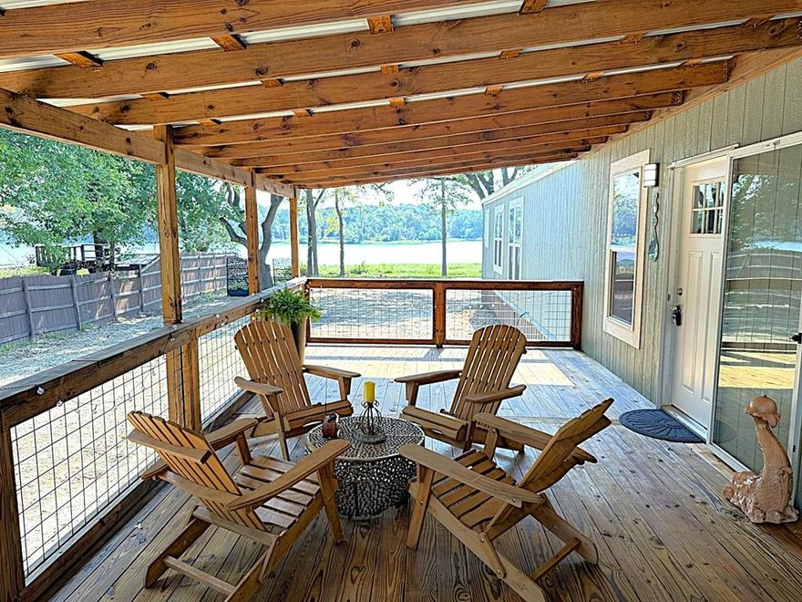 OWNER FINANCING AVAILABLE AND FOR LEASE!! Welcome to this beautiful, like-new 3-bedroom, 2-bathroom manufactured home offering a perfect blend of modern comfort and inviting charm. Nestled on over half an acre in the desirable Willow Lake Estates gated community of Wills Point, TX, this home provides a tranquil Lakeview setting with thoughtful details throughout.

Step onto the huge 12 x 30 covered front porch and enjoy evenings surrounded by the warm ambience of solar-powered lights, a perfect place to relax and entertain including a partially fenced backyard with potential for a fire pit area, additional back porch area, low HOA fees and over 0.50 acres of outdoor space. Inside, the home features a modern design with a wood accent wall, electric fireplace, high speed internet, and decorative ceiling beams in the spacious living room

The kitchen is a chef’s delight, offering plenty of cabinetry, a large island, and stainless steel and black appliances. Neutral tones throughout create a warm and welcoming atmosphere. All bedrooms are generously sized, with the primary suite featuring a tub and separate shower and a large walk-in closet.

This well-maintained property offers both comfort and convenience in a well-developed community, making it a must-see for anyone looking to enjoy a peaceful getaway or a suitable investment opportunity as a short or long term rental with beautiful lake views. Enjoy your boat or kayak on the wonderful tranquil waters with the boat slip and community park just a few hundred feet away. Offered for lease and owner financing also!