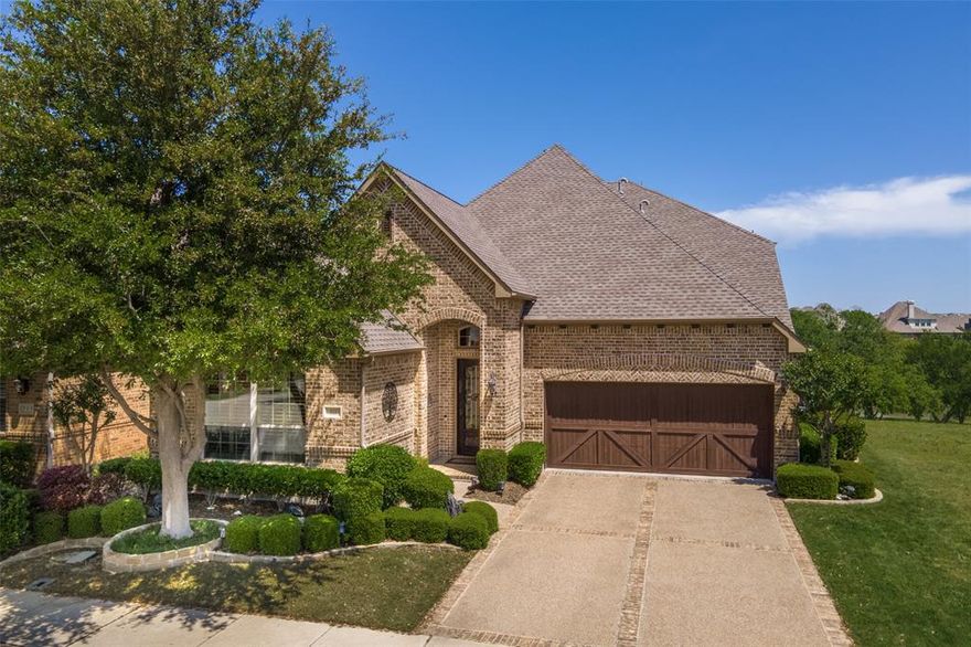 Wow! What a picturesque view and an amazing setting high above the Reserve Lake Park with views of the water, green space, trees, and walking trail nestled within the gated Reserve section of Castle Hills! Home also sides green space entrance to the walking trail. Large wrap around back patio gives you all-day relaxing views! Inside you'll find real nail-down handscraped wood floors in the entry, kitchen, breakfast, family room and primary bedroom. Downstairs second bedroom has its own full bath--perfect for guests or as an in-law suite. Updated kitchen with recent counterops and appliances features double ovens, a gas cooktop, large island, walk-in pantry with coffee bar, very large breakfast area and views of the back yard, greenbelt and water. Kitchen is open to the family room with the gas start fireplace. Primary bedroom also has wonderful views of the setting out back and the primary bath has a jetted tub, seperate shower, two vanities and a large walk-in closet.  Upstairs you'll find an additional bedroom and full bath, a game room, and a media room which could easily become a fourth bedroom, if needed. Don't miss the walk-out storage above the garage. Home is complete with tankless water heater, high efficiency windows and iron front door. Both HVAC systems replaced in 2023. This home has been meticulously cared for and nicely updated by the original owners.