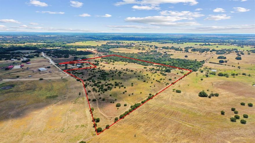 Just a few miles out and in Selden awaits this 53 acre tract on a cul-de-sac road and in the Stephenville School District. The home is a 2 bedroom 1.5 bath 2 carport. The oversized living area is open into the kitchen and the utility room has a full bath. There is one bedroom upstairs with a half bath.  This property has lots of big trees, is fenced and cross fenced, and would be perfect for your cattle or horses. The 3 cargo containers are included. The possibilities are endless here. Call today!