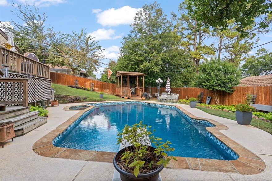 Designed for entertaining, this home features a spacious patio overlooking a sparkling diving pool—ideal for gatherings or quiet evenings under the Texas sky. The open layout seamlessly connects indoor and outdoor living, while large kitchen windows provide a serene view of the pool area, bringing natural light and elegance into your everyday routine.
