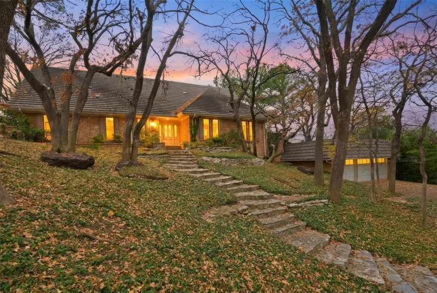 Tucked away in a sought-after neighborhood filled with character and one-of-a-kind homes, this property offers a peaceful escape from the ordinary. Mature trees and natural surroundings create a calming backdrop with scenic views, making the home feel like a quiet retreat while still being close to everything you need. Inside, the home is welcoming and move-in ready, with warmth, personality, and spaces that invite you to add your own touches over time. Thoughtfully priced to reflect opportunities for updates, this home allows you to personalize and grow into the space at your own pace. Spend weekends enjoying nearby Lake Arlington just minutes away, or take advantage of shopping, dining, and entertainment close by—including easy access to Six Flags, Hurricane Harbor, and major sporting events at AT&T Stadium and Globe Life Field, all typically within a 20-minute drive. A place to slow down, settle in, and truly make your own.