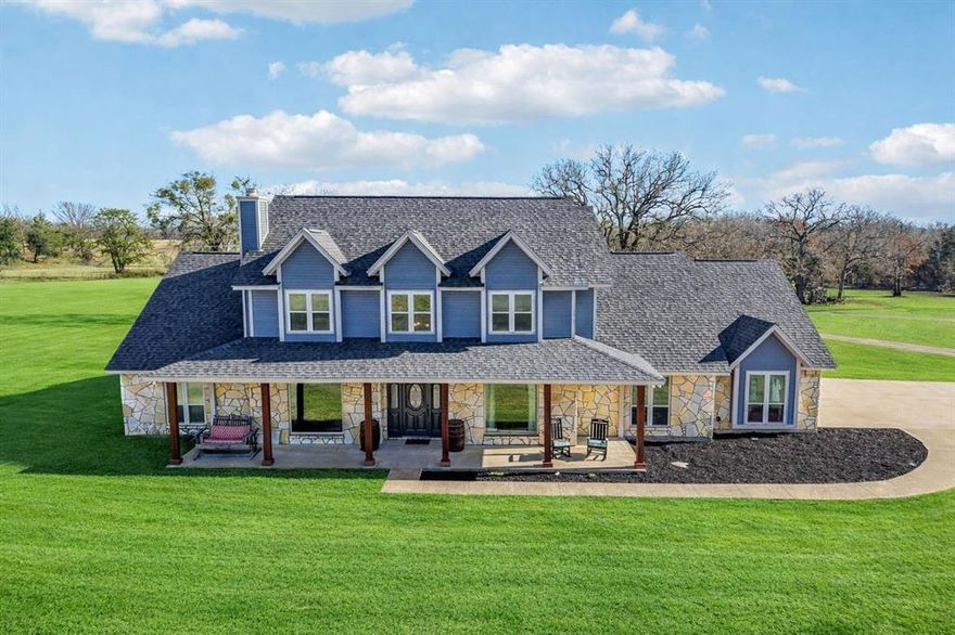 Beautiful 4-bedroom, 3.5-bath home situated on 13.7 private, tree-lined acres with major system updates already completed. All windows have been replaced, including stunning large front picture windows that flood the home with natural light. Newer roof, freshly painted exterior, and newer HVAC units provide comfort and efficiency.

Study features marble flooring and abundant light. Spacious formal dining with chair railing and slate floors. The expansive kitchen offers an island, granite countertops, stainless steel appliances with double ovens, and a glass cooktop. The main living area showcases slate flooring, a wood-burning fireplace, and an impressive wall of windows overlooking the acreage.

The primary suite features soaring ceilings, its own fireplace, dual closets, and a spa-like bath with granite countertops, separate vanities, jetted soaking tub, and walk-in shower.

The property is anchored by multiple majestic oak trees estimated to be over 300 years old — a rare and remarkable feature in Johnson County — providing incredible shade, character, and timeless natural beauty throughout the landscape.

Impressive 40x60 workshop with bay door includes fully equipped living quarters with full kitchen, living area, two bedrooms, and a full bath — ideal for guests, business use, or potential rental income. Additional improvements include a concreted dog kennel and a chicken coop, enhancing the functionality and appeal for those seeking true country living.

If you’ve been dreaming of space, privacy, mature trees, and self-sufficiency — this is it.