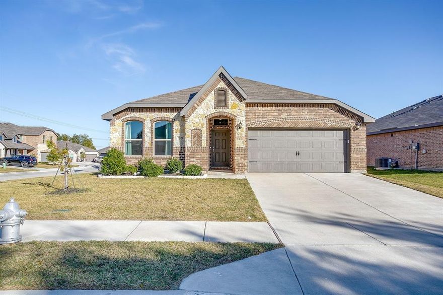 SPECIAL FINANCING AVAILABLE - INQUIRE WITH AGENT! Located in the welcoming community of Brookville Ranch, this move-in ready 2022 home offers modern comfort, smart design, and an ideal location in north Fort Worth. With 1,620 square feet, 3 bedrooms, and 2 full bathrooms, the home features a functional open layout designed for everyday living and easy entertaining. The main living area flows naturally into the dining space and kitchen, creating a bright and inviting central gathering space. The kitchen includes modern finishes, generous cabinetry, and plenty of prep space, making it both practical and stylish. A private primary suite offers a relaxing retreat with an en-suite bath and spacious closet, while two additional bedrooms provide flexibility for family, guests, or a home office. Positioned on a corner 0.15-acre lot, the home offers added privacy and a manageable yard perfect for outdoor enjoyment. A two-car garage provides convenience and additional storage. The location offers quick access to shopping, dining, and major commuting routes, while also being approximately 20 minutes from Naval Air Station Joint Reserve Base Fort Worth. Students attend schools in the highly regarded Eagle Mountain-Saginaw Independent School District. Additional perks include an assumable VA loan opportunity and washer and dryer conveying with the home. A fantastic opportunity to own a nearly new home with modern finishes, a great layout, and a convenient Fort Worth location. This home blends brand-new comfort with practical living and an excellent location — ideal for families, professionals or anyone looking for turnkey quality in a growing market.
