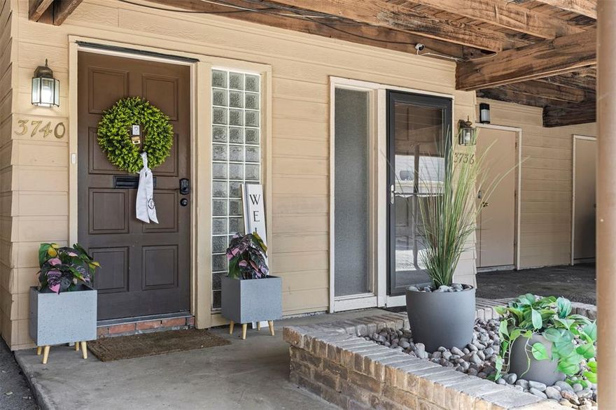 Discover this light, bright, and open 2-bedroom condo with a study nestled in the heart of Addison, just a short walk to the scenic trails and vibrant events of Vitruvian Park and within quick reach of the recreational amenities at the Addison Athletic Club. Enjoy close proximity to pickleball courts, basketball courts, walking paths, and the dining and entertainment of Addison Circle, with the prestigious Brookhaven Country Club just minutes away. The condo features covered parking with an attached storage area directly in front of the unit for added convenience. Inside, a welcoming entryway opens to a spacious living room highlighted by a cozy fireplace, built-ins, and wood-look tile flooring throughout the main level. The updated kitchen is a standout, complete with a gas range, quartz-topped island with eat-at bar, and ample cabinetry, perfect for cooking and entertaining. A dedicated laundry room, generous walk-in closets, and fresh 2025 interior paint enhance everyday comfort. The large secondary bedroom offers an en-suite bath, making it an ideal second primary suite. Additional efficiency upgrades include updated HVAC & windows. Step outside to a large private patio with a board-on-board fence that opens directly to a dog park and community courtyard. The home is just steps from the community pool and clubhouse, offering relaxation and recreation right at your doorstep. HOA dues include select utilities (water, sewer, gas), pest control, blanket insurance, and common-area maintenance for a low-maintenance lifestyle. This beautifully updated condo combines walkability, convenience, and comfort in one of Addison’s most desirable locations, perfect for those seeking an active yet relaxed lifestyle.