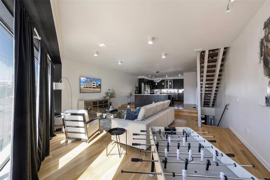 Unique opportunity for luxury urban living in sought after location... just around the corner from Deep Ellum, the Dallas Farmers Market, Fair Park, and more! This modern four story townhome features high end finishes throughout! Upon entering through the private 2 car garage, you will be greeted by stained concrete floors, a spacious guest suite with a full bath, and access to the enclosed outdoor patio! Ascend to the second floor, which offers gorgeous hardwood flooring and an open concept floorplan perfect for entertaining! The gourmet chef's kitchen is complete with stainless steel appliances, dual islands, quartz countertops, and a wine fridge! The expansive living room is complemented by floor to ceiling windows, allowing for plenty of natural light! Retreat to the oversized primary suite on the third floor where you can enjoy more views of the city! The luxurious spa-like bath is complete with vaulted ceilings, slate floors, a jetted tub, walk-in shower and a large walk-in custom closet! The versatile third bedroom and laundry room with a stunning industrial style slider door can also be found on the third floor! Enjoy breathtaking panoramic views of the Dallas skyline on the massive fourth floor rooftop patio! This outdoor space allows for plenty of space to entertain, highlighted with modern outdoor lighting, recently refinished decking, and a gas line for grilling! This one-of-a-kind property has had endless recent updates including a new roof in 2025, repainted throughout, refinished hardwood flooring, and more! No HOA!! Additional parking can be found in the gravel area behind property, which is owned by this unit!