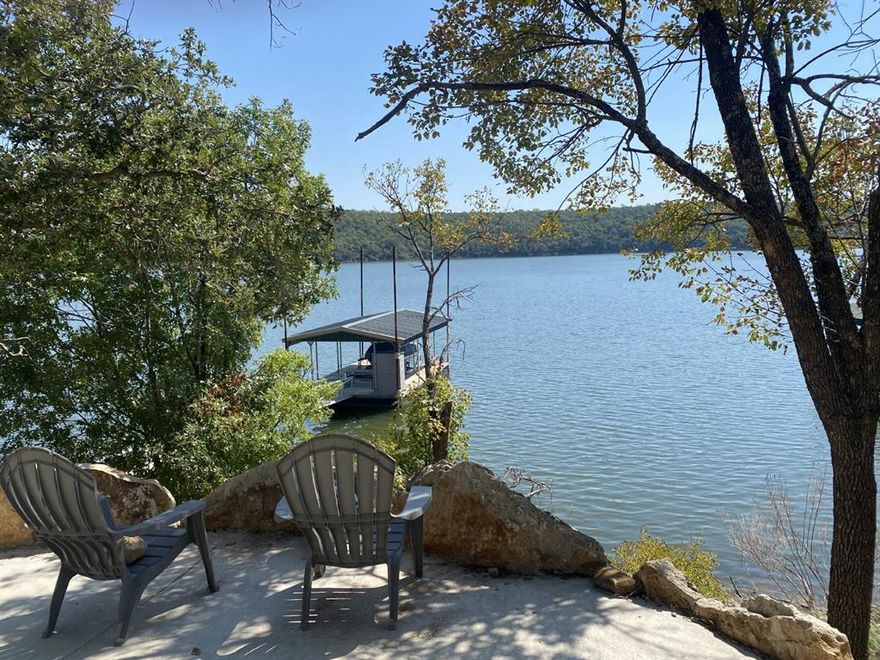 1.04 acre waterfront property on beautiful Lake Bridgeport.  100 foot wide lot with building site at the top of the property.  Beautiful lake views.  Concrete drive down the property to retaining walls and steps to the boat dock.  Gated community with boat ramp, swimming pool and pickle ball court.