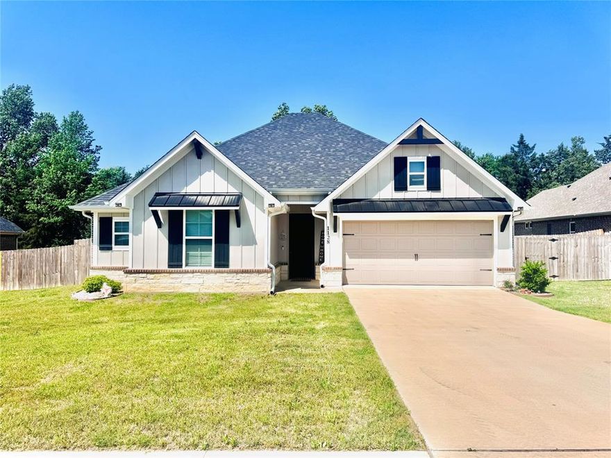 This stunning like new home was finished in 2022 by Conaway Homes. This spacious 4 bedroom 2 bath home features a split main bedroom. The main bedroom has a beautiful en suite with garden tub and separate shower with a dual sink vanity. The large walk in-closet conveniently connects to the laundry room and mudroom space. The 3 guest rooms are located within steps from guest bathroom. Enjoy the open concept kitchen, living, and dining area with wood look luxury vinyl plank flooring. The beautiful kitchen features a large center island, upgraded quartz countertops, and stainless steel appliances. Step out back to enjoy your privacy on the covered back porch with fully fenced backyard. Storage building will convey. Owners recently installed a 1800KW GENERATOR. Come take a look at this spectacular home located in the sought after Bullard Creek Ranch subdivision. Like new but added features of the generator, fence, and storage shed!