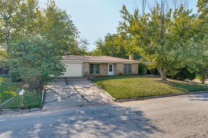 Payments could be as low as $1000.00 P.I. a month the first year. Charming 3-Bedroom Home in Peaceful Bowie, TX!  Nestled in the beautiful and quiet city of Bowie, this inviting 3-bedroom, 2-bath home is ready to welcome you! Enjoy small-town living just northwest of DFW, with easy access to restaurants, schools, and major highways — offering both tranquility and convenience.  Step inside to a warm and welcoming living room featuring a beautiful brick fireplace with a raised hearth, perfect for relaxing evenings or entertaining friends and family. The open layout flows effortlessly into the dining area and kitchen, creating a seamless space for gatherings. The kitchen stands out with its abundance of cabinetry and stunning custom hardwood countertops — a unique focal point that’s sure to spark conversation.  The spacious primary suite includes an ensuite bathroom for added comfort and privacy, while the additional full-sized bedrooms feature walk-in closets and plenty of room to make your own.  Step outside to your covered patio overlooking a huge backyard — the perfect setting for weekend barbecues, outdoor games, or simply unwinding under the Texas sky. A storage shed adds extra convenience for tools and lawn equipment.  This charming home offers the perfect blend of comfort, character, and location. Furniture is included! Don’t miss your chance — come see it for yourself before it’s gone!