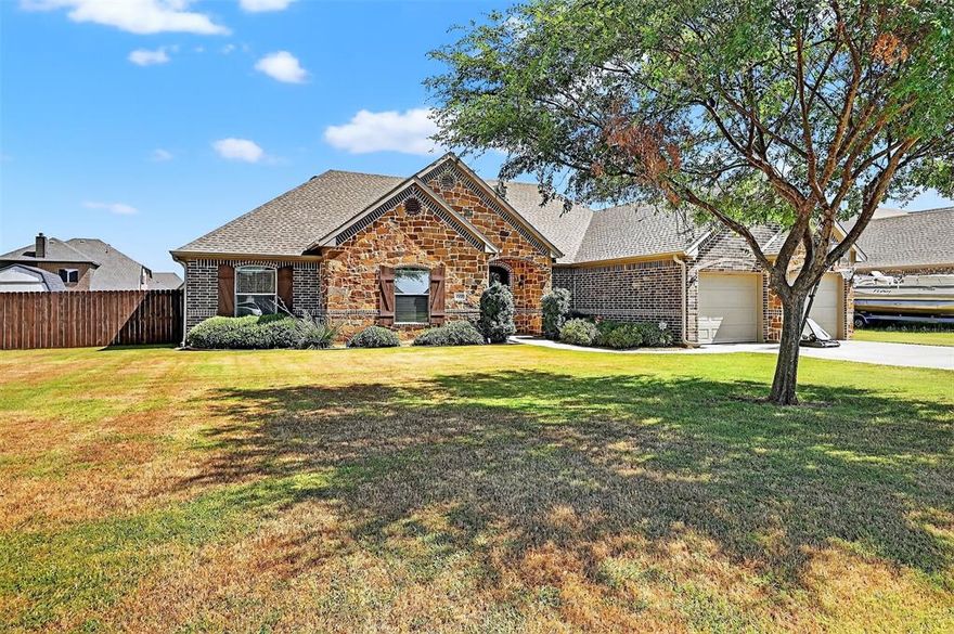 Welcome to 703 Shirley Jean in Collinsville, TX! This beautiful 4-bedroom, 2-bathroom home offers 2,155 square feet of well-designed living space on a spacious one-third-acre lot. As you enter, you're welcomed by vaulted ceilings and rich wood flooring that set the tone for the warm and inviting atmosphere throughout the home. The open-concept living and kitchen area is ideal for both entertaining and everyday living, with a large center island featuring bar seating, granite countertops, stainless steel appliances, and gorgeous wood cabinetry offering plenty of storage. There's also a dedicated eat-in dining space that overlooks the backyard. This split floor plan offers privacy and flexibility, with the primary suite tucked away from the other bedrooms. The primary retreat features a spacious layout and an ensuite bathroom with dual vanities, a separate shower, a relaxing jetted tub, and a walk-in closet. The additional three bedrooms are located on the opposite side of the home—perfect for family, guests, or even a home office or playroom if a fourth bedroom isn’t needed. Step out back and enjoy the Texas evenings on the large covered patio with a charming gable roof, all enclosed by a 6-foot privacy fence that creates the perfect setting for outdoor relaxation or entertaining. Located in a quiet, established neighborhood close to local schools, this home combines comfort, functionality, and convenience in a small-town setting. Don’t miss your chance to make it yours!