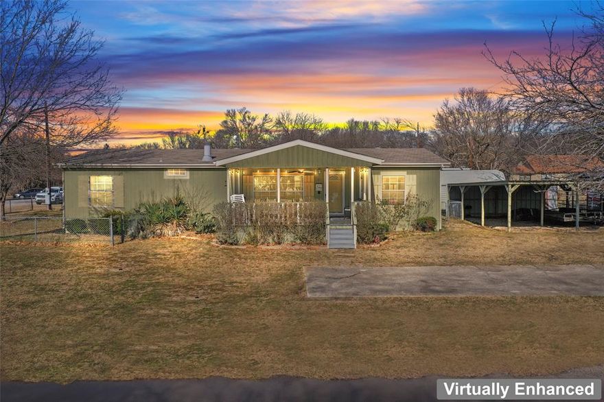 Enjoy tranquil lake living in this 3 bedroom, 2 bath home in Lake Moss community, perfectly positioned to capture peaceful water views and community amenities. A large covered front porch offers an inviting space to relax and take in the scenic lake setting. Inside, the home features an open-concept kitchen, dining and living area, ideal for everyday living and entertaining. The kitchen includes a center island and flows seamlessly into the living area, where large windows and a fireplace in the den creates a warm atmosphere with lake views. The primary suite is a true retreat, highlighted by a spacious en-suite bathroom with a large soaking tub and its own fireplace, providing comfort and luxury. A designated desk area offers flexible spack for working at home or homework.  Additional features include a designated dock space with a dock provided, three covered carport parking spaces, fenced backyard, additional storage shed, designated 25 foot leased waterfront space, and located across from the 4.33 acres community park where the designated dock space is.  The property combines lake access, functional design, and thoughtful amenities-an excellent opportunity to enjoy relaxed lakefront living on Lake Moss. All furniture and appliances convey with the sale.