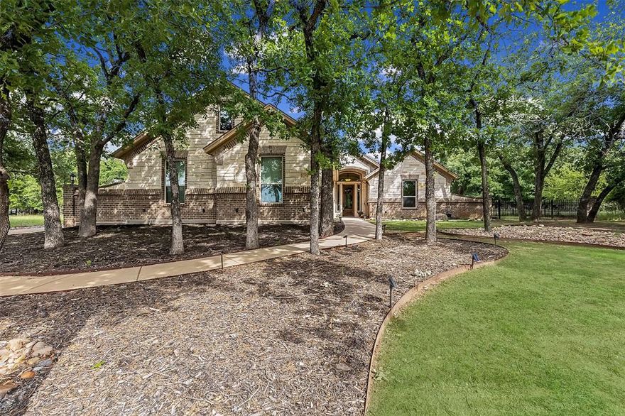 Picturesque Home Located in the Gated Reserve at Sugartree, This is a Fantastic Community Ideal for the Golfer, From the Course to the Amentity Center & Pool, Drive Up to a Quaint Setting on a Half Acre with Mature Oak Trees, Upon Entering You will Notice & Appreciate the Meticulous Care & Maintenance the Owners have Provided in this Well Maintained Property, The Open Floorplan is Functional & Effortlessly Flows, Living Area Offers Floor to Ceiling Stone Fireplace with Gas Logs & Thermostatic Control, Raised Hearth, Custom Mantle Accented with Built Ins, You will Love the Luxury Vinyl Plank Flooring, Custom Trimwork & Wall of Windows Thoughout, Chef's Kitchen Boasts Generous Work Island & Breakfast Bar, 36 inch Gas Cooktop, Stainless Steel KitchenAid Convection Oven & Appliances and Walk In Pantry, Secondary Living Area or Flex Room is Tucked Away, Separated by a Pocket Door and Includes Surround Sound & Private Patio Access, Primary Suite is Inviting and Spacious, Spa Like Bath with Jetted Soaking Tub, Separate Shower, Sinks & Vanity, Massive Walk In Closet Connecting to the Oversized Laundry Room Complete with Sink, Cabinets, Built In Desk, Mud Lockers & Ample Storage, Oversized Garage with Workshop, Built in Cabinets & Utility Sink, Outdoor Offers Expansive Covered Back Porch Facing East & Inviting Stone & Brick Firepit Perfect for Relaxing in the Evenings, Yard is Completely Set Up with French Drains, Full Fencing, 2 Propane Tanks, Sprinkler System & Ample Trees Providing an Abundance of Shade. Upgrades Abound Including New Roof with Architectural Shingles Installed 2022, Foam Insulated, Climate Controlled Attic, NOVO Water Purification System & Softener System, Ozone Air Purifier, Electrostatic UV Filter System, French Drain System, New Carpet & Luxury Vinyl Plank Flooring, Welcome Home to Sugartree in the Sought After Brock ISD!