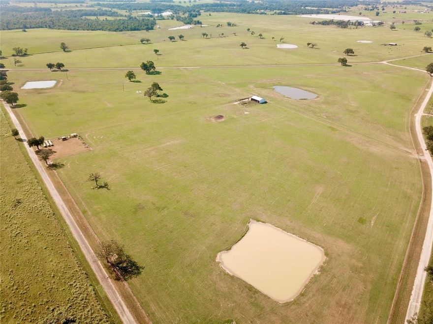 Tract 3 has almost 16 acres of pristine property with road frontage on 2 sides. Very well maintained coastal Bermuda pasture land with a nice pond. 1200 sf metal barn with corrals and pens, and gutters to catch water. Fenced on all side. Great location to build your dream home and raise livestock. Restrictions apply. Tract 1 available for purchase.