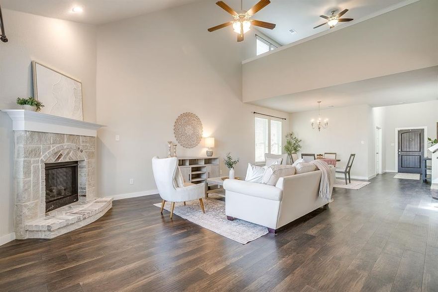 Welcome home! Built by Highland Homes in 2017 this home is move in ready and a 30 min drive to DFW airport.  Bar C Ranch is convenient to several major thoroughfares in DFW and shopping and dining is just minutes away.  The home has tons of windows bringing in natural light, fresh paint, wood flooring in the living area and updated lighting!  Featuring 5 bedrooms, a 3 car tandem garage, 3 living spaces, a formal office, abundant storage, a large kitchen with a pantry and ALL in a great neighborhood with amenities!  Great storage, formal office, a second bedroom and full bath on the first floor.  The open concept entertainers kitchen features granite counters, gas cooktop, bar seating at the large island, walk in pantry and stainless appliances.  The primary ensuite is light and bright and has a generous sized closet in the primary bathroom.  Large open living room with tall ceilings and gas fireplace.  Upstairs has 3 additional bedrooms and a bathroom, loft and a third living space!  Low maintenance grassed and fenced back yard with sprinkler system and is maintained weekly.  Low energy bills with fully paid off solar panels.  Roof, insulation added and gutters in 2021, Water Heater 2021, HVAC serviced regularly with filters changed every 2 months and a whole home surge protector.  Community park, pool and playground.  You don't want to miss this house!