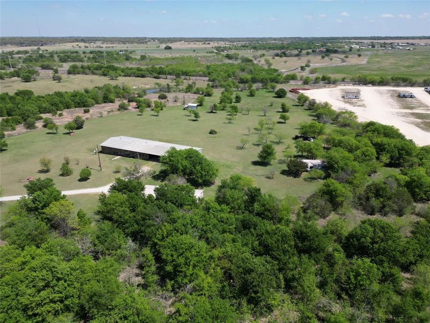 Welcome to your private Texas retreat on 26+ acres at 2101 Ridge View Drive in Cleburne. Tucked behind a gated entrance, this property offers the perfect blend of space, functionality, and peaceful country living—just a short drive from town.
As you enter, you’re greeted by wide-open land, mature trees, and endless possibilities. Whether you're looking for a homestead, ranch setup, or a place to run a business from home, this property is built to accommodate.
The land is the true highlight—26+ acres of usable space ideal for livestock, recreation, or future expansion. With plenty of room to roam, you’ll enjoy privacy, scenic views, and that hard-to-find freedom that’s becoming increasingly rare in North Texas.
For those needing workspace or storage, the property features two large shops along with additional outbuildings, providing flexibility for equipment, hobbies, or business operations. Whether you're a contractor, car enthusiast, or simply need extra room, this setup delivers.
The gated entry adds an extra layer of security and exclusivity, making this property feel like your own secluded estate.
Opportunities like this don’t come often—acreage, functionality, and privacy all in one. Come experience the potential and lifestyle this property has to offer.