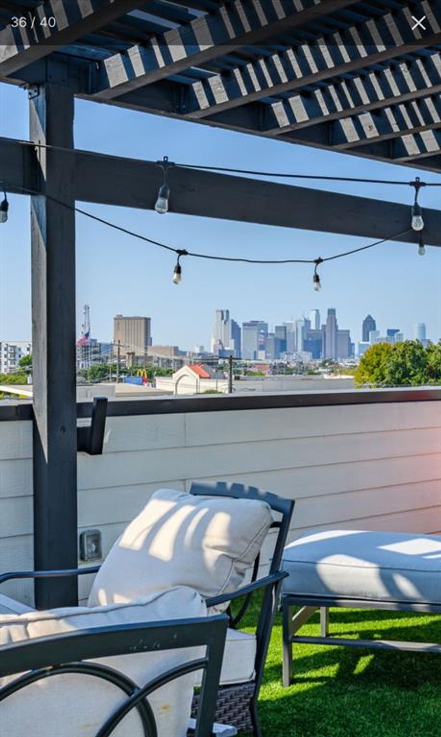 Live in the heart of Lower Greenville in this stylish townhome that blends modern design with exceptional walkability. From the moment you enter, you’ll appreciate the quality craftsmanship and thoughtful layout, featuring hand-scraped hardwood floors, abundant natural light, and three private bedroom suites each with its own ensuite bath and updated designer finishes. The first floor offers a private guest suite, laundry room, and an oversized two-car garage. Upstairs, the second level is designed for effortless living and entertaining. The open-concept layout seamlessly connects the kitchen, dining area, wet bar, and spacious living room, creating an inviting space to gather. Step onto the private balcony to enjoy the energy of Greenville Avenue or fire up the grill for an evening with friends. The third level features the secondary bedroom and the serene owner’s suite, complete with soaring ceilings, a generous walk-in closet, and a spa-like bath with double vanities and an oversized walk-in shower. At the top, a rooftop terrace delivers the ultimate city-living experience. Enjoy unobstructed views of the Downtown Dallas skyline from the pergola-covered patio perfect for dining, lounging, and entertaining day or night. Located just steps from neighborhood favorites like HG Supply Co., La La Land Café, Truck Yard, Trader Joe’s, and all that Lower Greenville has to offer, this home provides unbeatable access to some of Dallas’ best dining, shopping, and nightlife. Turnkey opportunity available ask about partial furnishings. With no HOA restrictions, this property also presents an excellent rental opportunity, offering flexibility for both homeowners and investors alike. Schedule your showing today. Homes like this don’t stay hidden for long.