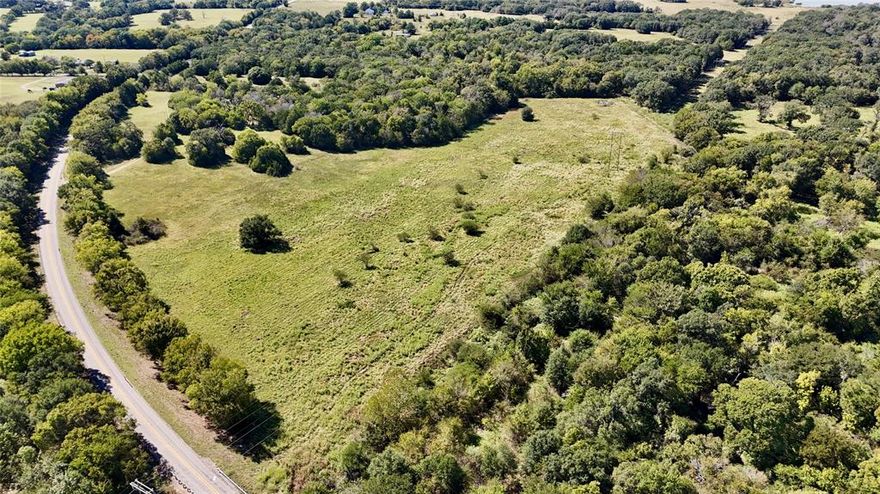 Extensive road frontage with approximately 53 acres on the west side of FM 1651 and approximately 14 acres on the east side of FM 1651. Open area on the hill is a great location for building a home. Heavily wooded area to ensure privacy and open areas for your livestock to roam. Property is partially in the flood plain. Please see map in photos.