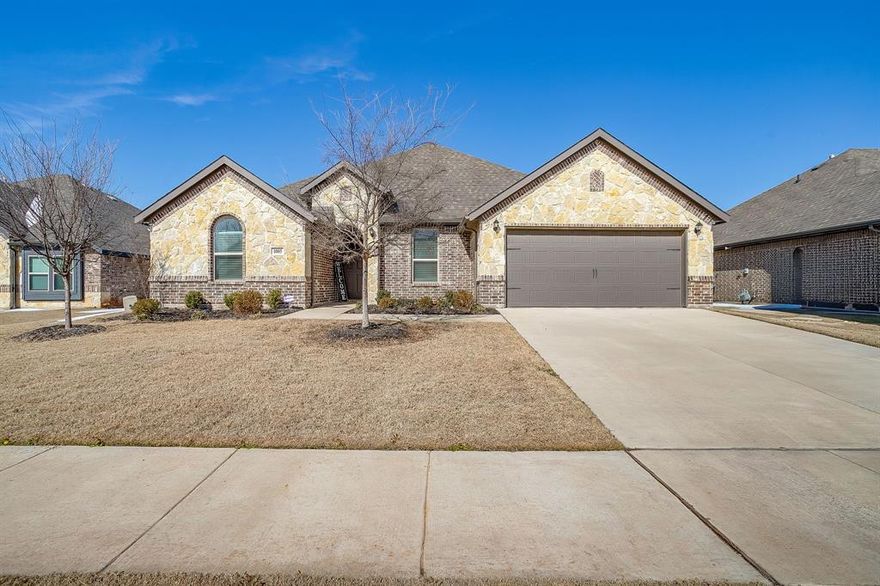 Back on the market due to no fault of the sellers.  This beautiful home with a brick and stone exterior features nearly 2,700 sq ft of well designed single-story living. This home offers four bedrooms, three full baths, a study, and a desirable three-way split bedroom layout providing privacy for everyone. The open floor plan is ideal for family gatherings and entertaining. The spacious kitchen features a large island, granite countertops, stainless steel appliances, a gas cooktop, abundant cabinet and counter space, and a walk-in pantry. The living area showcases a beautiful stone fireplace and large windows that fill the home with natural light. The private owner’s suite includes an ensuite bath with dual vanities, garden tub, separate shower and an oversized walk-in closet. Three secondary bedrooms and two additional full baths complete this beautiful home.  Situated on an oversized lot with a generously sized covered patio. Located in award-winning Mansfield ISD and complete with a 2-car garage.   Built in 2022, this energy efficient home still has some builder warranties in place.  Easy access to Hwy 287 S, shopping, restaurants and entertainment.