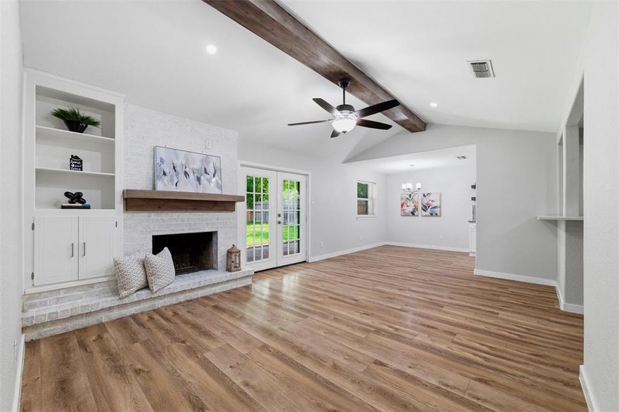 Built with classic brick and thoughtfully updated, this 3 bed, 2 bath home in Edgecliff Village offers comfort, style, and function. Recent improvements include all new windows in 2022, new flooring throughout the main living areas in 2023, a covered back patio added in 2024, updated countertops, and a new front door. Inside, the family room features vaulted ceilings with a striking beam detail that creates a true focal point, along with a brick wood burning fireplace, built-in shelving, and an open layout connecting the kitchen, dining, and living areas. The kitchen includes white cabinetry, updated countertops, a wall mounted range hood, and a wet bar addition. Both bathrooms have been refreshed with updated vanities, framed mirrors, and tiled surrounds. The primary suite offers a walk-in closet with built-in shelving. Out back, enjoy a large fully fenced yard with a storage shed, a mature shade tree, and a new covered patio perfect for entertaining. Conveniently located in Edgecliff Village just minutes to I-35W and I-20, Hulen Mall, Kroger on McCart, Clearfork dining and shopping, Benbrook Lake, and short drive from Downtown Fort Worth and Sundance Square.