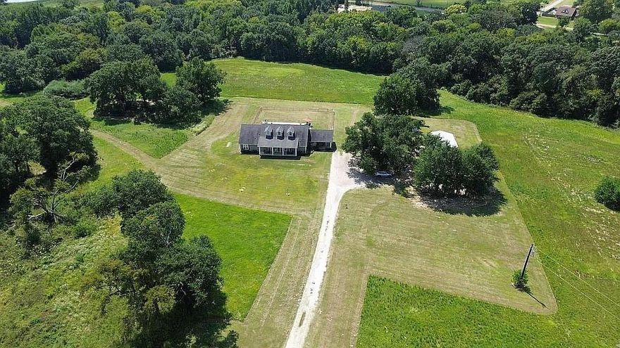Private Modern Farmhouse on 17.86 Acres in Canton ISD! Enjoy peaceful country living just minutes from Canton schools and downtown. This 2,640 sq. ft. modern farmhouse offers an ideal blend of style, space, and seclusion on 17.86 wooded acres with an in ground pool and scenic views.The open concept layout features vaulted ceilings, exposed beams, 9ft ceilings throughout, and large windows overlooking the private backyard and acreage. The kitchen impresses with granite countertops, double ovens, electric cooktop, farmhouse sink, butcher block island with seating for six, sleek white cabinetry, and a walk in pantry. The spacious laundry room provides extra storage and space for an additional refrigerator or freezer.
The primary suite includes a spa like bath with freestanding tub, walk in shower, and serene views. A guest suite offers an ensuite bath and walk in closet, plus two additional bedrooms with a shared hall bath. A separate 1 bedroom, 1 bath guest apartment with full kitchen, side porch entrance, and pool access is perfect for guests, in laws, or a home office.Property highlights:24x35x12 metal building with in ground basketball hoop,Two deep water wells (main + future irrigation), 40ft shipping container with roll up door for storage and Ag exempt acreage. Additional 29.6 acres with pond available, expanding the total to 47.46 acres. Just 1.6 miles from Canton High, 1.5 miles from the junior high, and 2.1 miles from downtown. Country living with town convenience!!