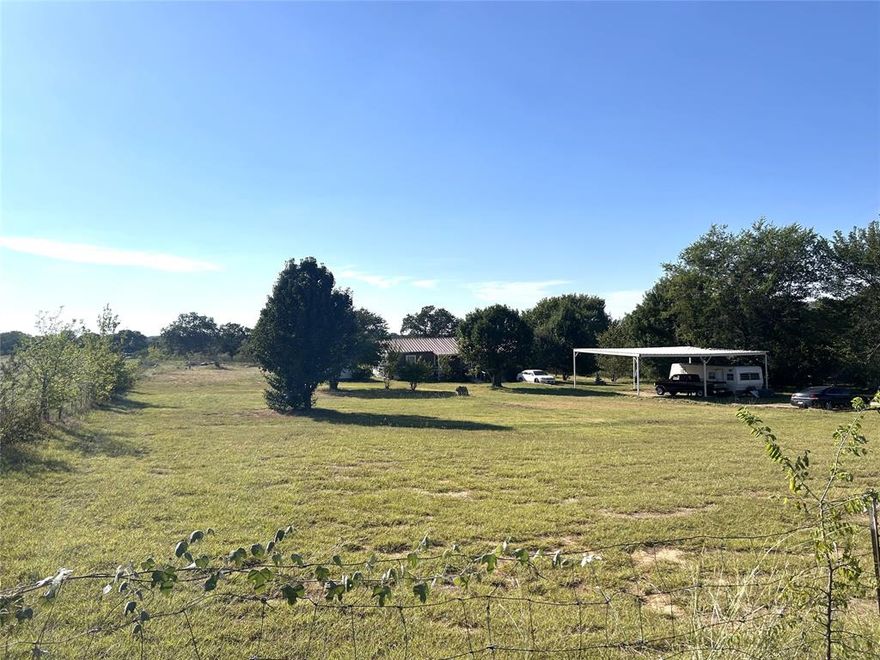 Gorgeous 2 Acres with a real home! Family room addition, RV or 4 Vehicle carport, and several out buildings. House needs work but this beautiful spot will be amazing with some TLC. On the remote outskirts of Springtown TX it is a diamond in the rough and worth taking a look at this AMAZING country property!