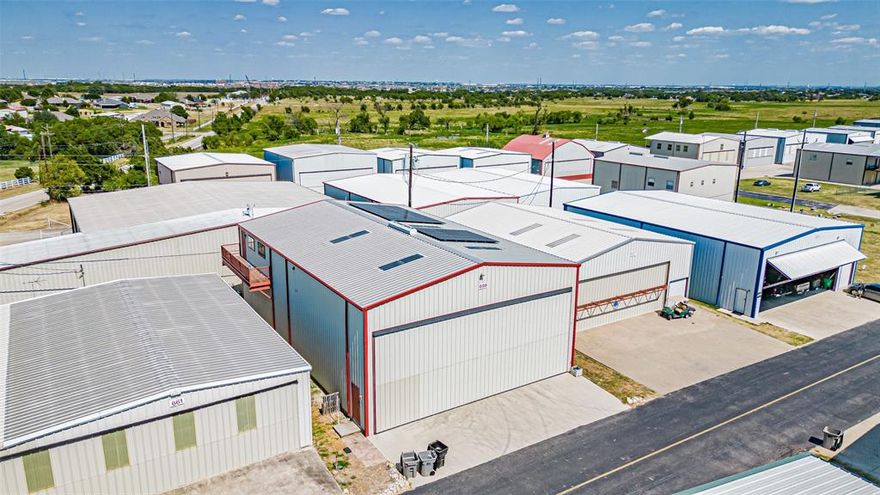 Nestled within the prestigious and tightly knit Hicks Airfield gated community, this remarkable home offers a rare fusion of lifestyle and convenience for the true aviation enthusiast. Here, the unparalleled luxury of direct private airstrip access meets the comfort and sophistication of a thoughtfully designed residence. Imagine opening the door to your hangar and rolling directly onto the runway—your aircraft ready for a spontaneous weekend getaway or a quick flight to your next adventure.
The property’s crown jewel is its massive 50' × 75' insulated hanger, boasting soaring 24-foot eaves, a 28-foot peak, and a 46' × 21' Wilson aluminum bi-fold door. This versatile space accommodates aircraft, RVs, luxury vehicles, boats, or large-scale hobbies, and comes fully equipped with a 50 AMP RV receptacle, RV sewer drain, and extensive polyurethane insulation for optimal comfort year-round.
Inside, the main living quarters span approximately 4,800 sq ft across two levels. The ground floor features an office with built-in storage, a full bathroom, and a convenient kitchenette—perfect for entertaining or supporting the hanger’s activity hub. Upstairs, vaulted ceilings and skylights flood the open-concept living area with natural light. Two bedrooms and additional baths offer intimate, relaxing retreats, while high-quality finishes, decorative lighting, and hardwood, tile, and laminate flooring add warmth and character.
Modern efficiency meets eco-conscious living with 36 solar panels, significantly reducing energy costs. Additional comforts include central heating and cooling, high-speed internet wiring, and premium appliances. Outside, a covered deck, balcony, and dedicated RV or boat parking enhance the property’s appeal.
With secure gated access, an active aviation community, and proximity to Fort Worth’s amenities, 659 Aviator Drive is more than a home—it’s a launchpad for adventure and a sanctuary for those who dream of life both on the ground and in the clouds