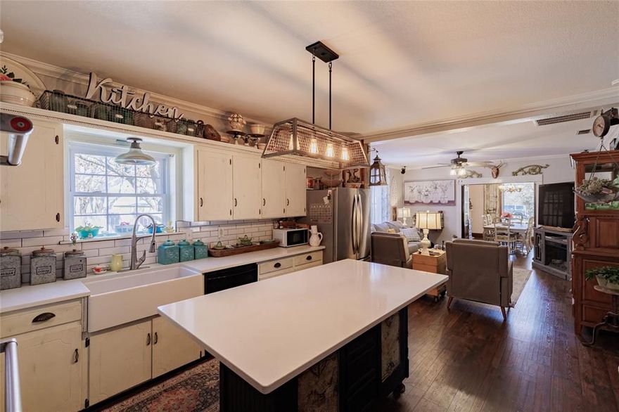 Step back in time with this beautifully maintained 1918 two-story home in the heart of Alvord. Offering 4 bedrooms, 3 baths, and 2,906 square feet, this timeless property blends historic charm with thoughtful updates for modern living. 
From the moment you arrive, the large front porch welcomes you to slow down and stay awhile. Inside, you’ll find an impressive staircase, abundant natural light from oversized windows, and new luxury vinyl plank flooring throughout. The inviting kitchen serves as the heart of the home, with plenty of space for friends and family to gather and create lasting memories.
Situated on a spacious 0.46-acre corner lot, the property is enclosed by a classic white picket fence and shaded by mature pecan trees, creating a picturesque setting. The location is ideal—just a short distance to Alvord ISD, the grocery store, post office, bank, and more.
Bonus features include a 2,000+ square foot commercial building with six rooms and two restrooms—perfect for a business opportunity, office space, studio, or additional income potential. A storm shelter in the backyard adds peace of mind.
This rare Alvord gem offers character, space, and versatility, all in one remarkable property. Motivated seller!  Check out the courting bench..the ceilings...the custom and original wood work...the staircase...There are some smart features in the home. Surround sound! Water filtration system! All information herein deemed reliable but not guaranteed. Buyer and Buyer agent should verify all information in this listing, flyers and advertising, including but not limited to the sq footage, schools, taxes, easements, restrictions, zoning, etc...