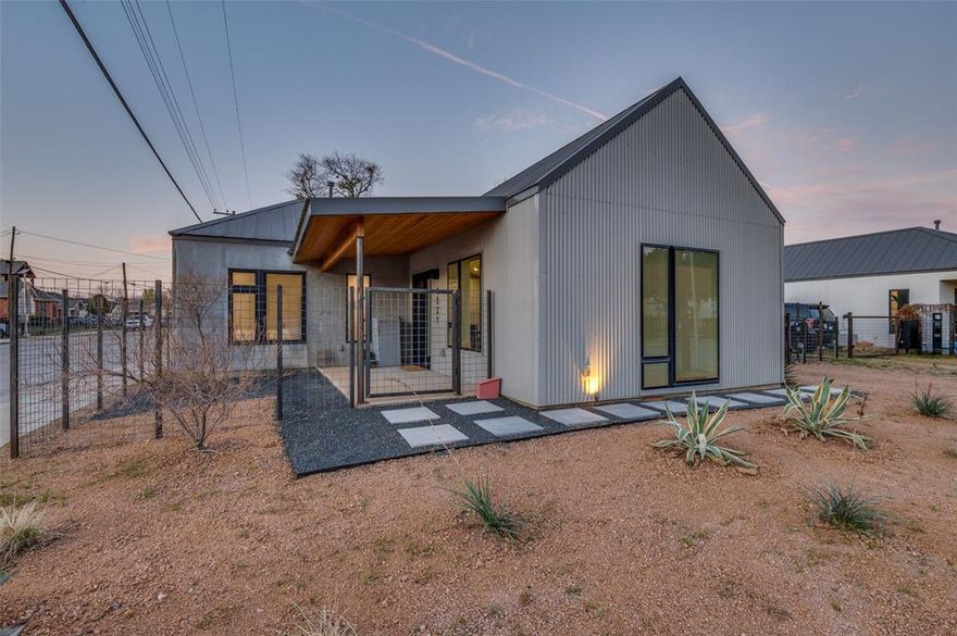 Architecture, design, and landscape come together in this striking Texas Modern residence. Clean lines, natural materials, and thoughtful spatial design define the property, where a private courtyard anchors the home and creates a seamless connection between indoor living and outdoor entertaining.
The residence blends concrete, stucco, and metal with warm wood accents, while light-filled interiors, durable concrete floors, and premium fixtures offer a balance of modern design and everyday livability.
In 2025, the exterior landscape was transformed into a low-maintenance zero-scape environment featuring black gravel in the courtyard, layers of granite gravel throughout the grounds, and sculptural drought-resistant plantings including agave, desert willows, and cacti. A newly completed entry footpath enhances the arrival experience, and a French drain system improves backyard drainage while preserving the existing irrigation system.
Ideally located minutes from Trinity Groves, Sylvan Thirty, and the Bishop Arts District, the home offers the rare opportunity to enjoy architectural design, private outdoor living, and convenient access to some of Dallas’ most vibrant dining and entertainment destinations.